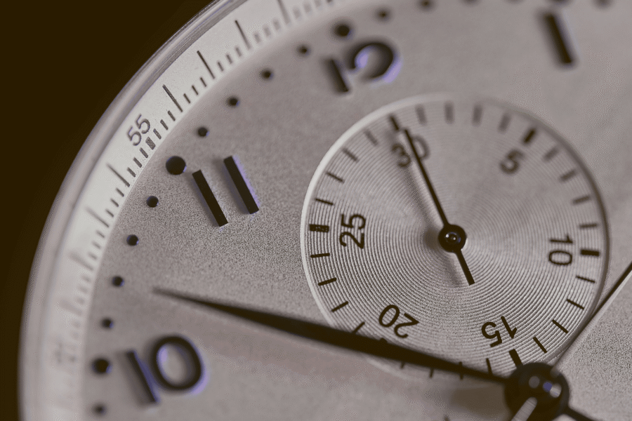 Close-up of a silver stopwatch face